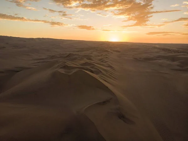 Aerial postcard panorama sunset view of isolated lonely single man person dry sand dunes desert of Huacachina Ica Peru — Stock Photo, Image