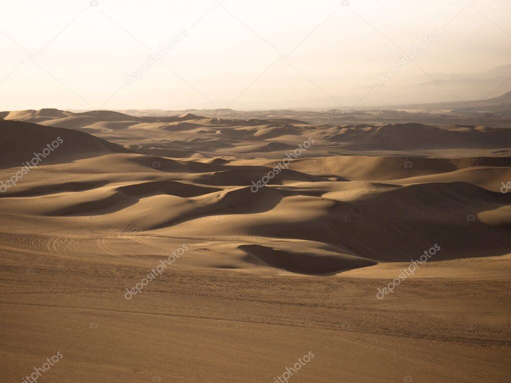 Panoramic postcard view of dry sand dunes texture pattern coastal desert oasis of Huacachina Ica Peru South America