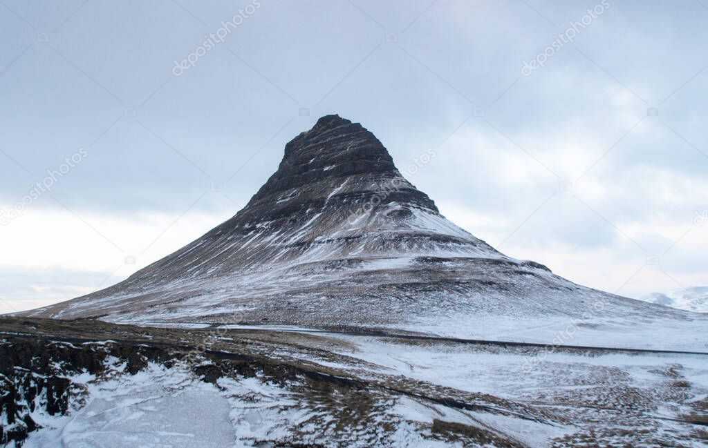 Winter panorama view of Kirkjufell mountain blue hour sunrise in Grundarfjordur Snaefellsnes Peninsula Western Iceland