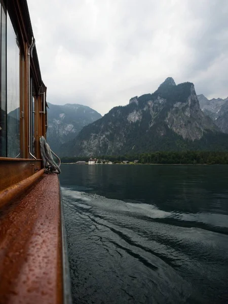 Panorama electric boat on alpine mountain lake Konigssee Koenigssee King Schonau Berchtesgaden Bavaria Germany alps