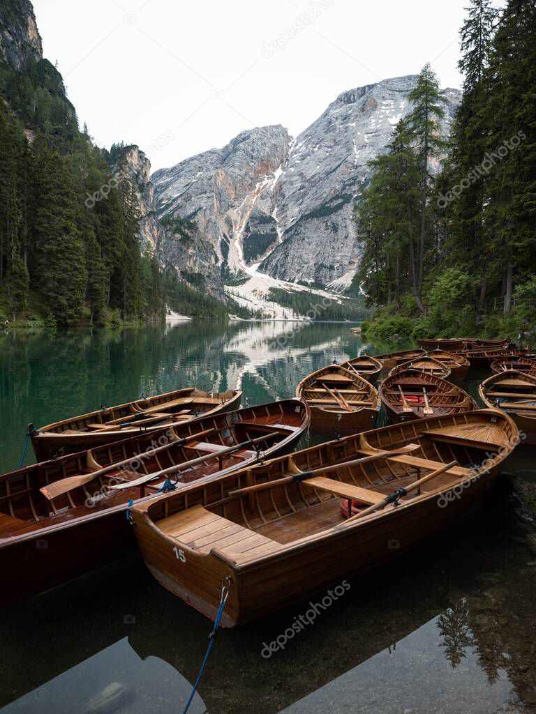 Wooden rowing boat panorama at Lago di Braies Pragser Wildsee alpine mountain lake Dolomites alps South Tyrol Italy