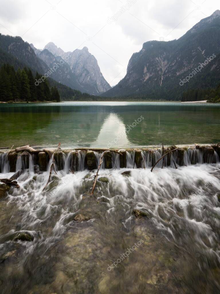 Alpine mountain lake landscape panorama at Lago di Dobbiaco Toblacher See in South Tyrol Dolomites alps Italy Europe