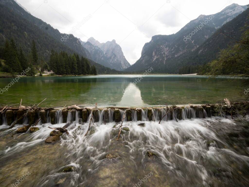 Alpine mountain lake landscape panorama at Lago di Dobbiaco Toblacher See in South Tyrol Dolomites alps Italy Europe