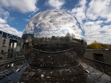 Mirror reflection of La Geode sphere ball round museum Parc de la Villette City of Science and Industry Paris France clipart