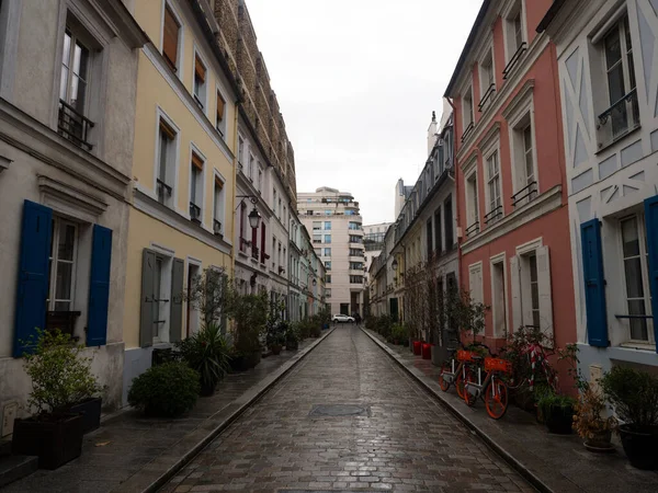 Panorama cobblestone pedestrian street view of colorful houses exterior building facades in Rue Cremieux Paris France — Stock Photo, Image