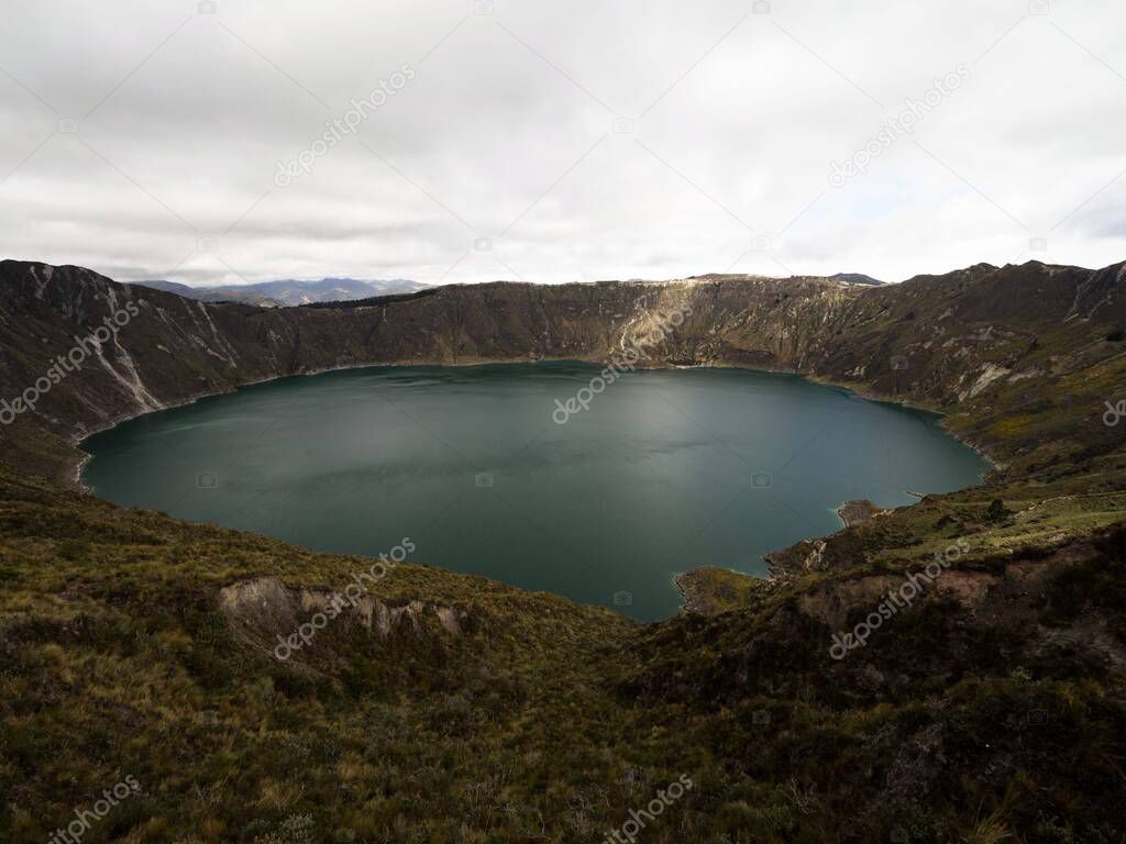 Panorama view of andean volcano caldera crater lake Quilotoa rim ridge loop in Pujili Cotopaxi Ecuador andes South America