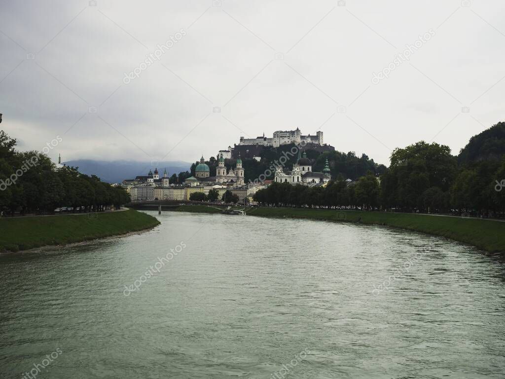 Panorama cityscape view of historic old town with Hohensalzburg castle and Salzburg cathedral at Salzach river, Austria alps Europe