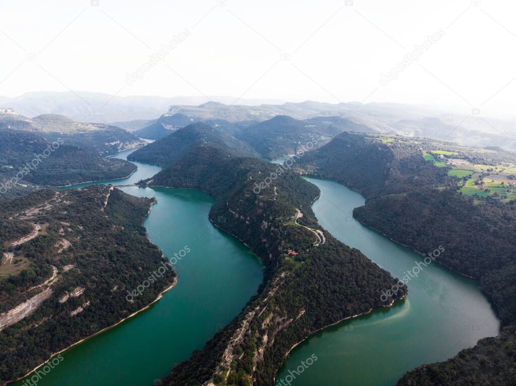 Aerial panorama at Sant Pere de Casserres cloister monastery isolated church on hill at Ter river bend Les Masies de Roda Osona Catalonia Spain Europe