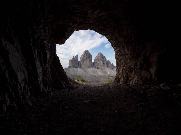 Cave window view of Tre Cime di Lavaredo peak summit alpine mountain panorama in Sexten Dolomites Belluno South Tyrol Italy alps Europe