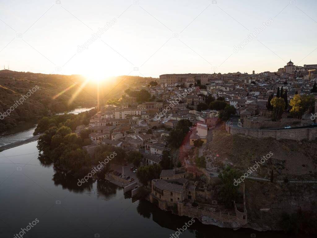 Aerial sunset panorama view of historic medieval architecture Toledo cityscape skyline at Tagus river in Castilla La Mancha Spain Europe
