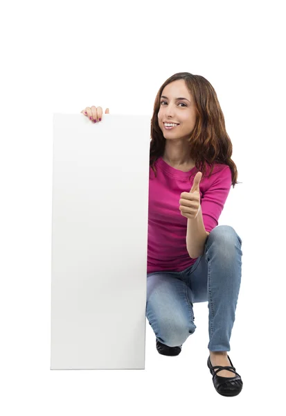 Mujer mostrando un cartel publicitario con el pulgar hacia arriba —  Fotos de Stock