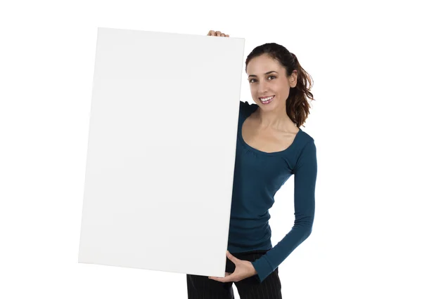 Smiling young woman holding a white poster — Stock Photo, Image