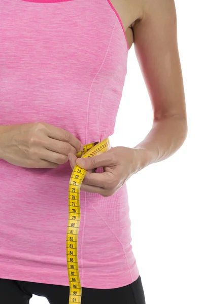 Mujer fitness midiendo su pérdida de peso —  Fotos de Stock