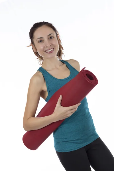 Mulher fitness com tapete de ioga — Fotografia de Stock