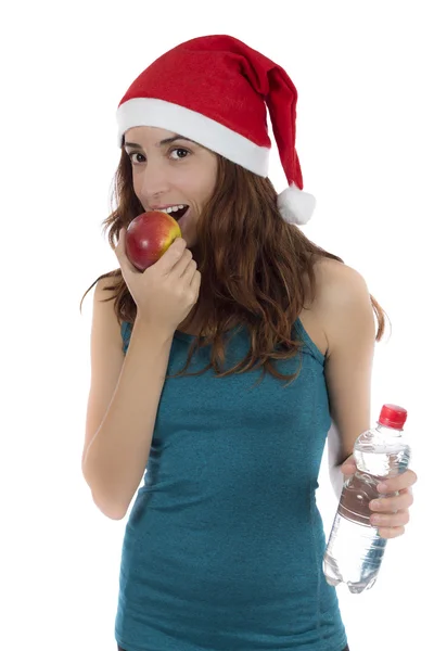 Ajuste a mulher de Natal na dieta comer maçã — Fotografia de Stock