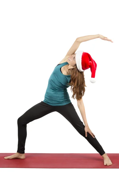 Noel yoga kadının yapması savaşçı poz ters — Stok fotoğraf