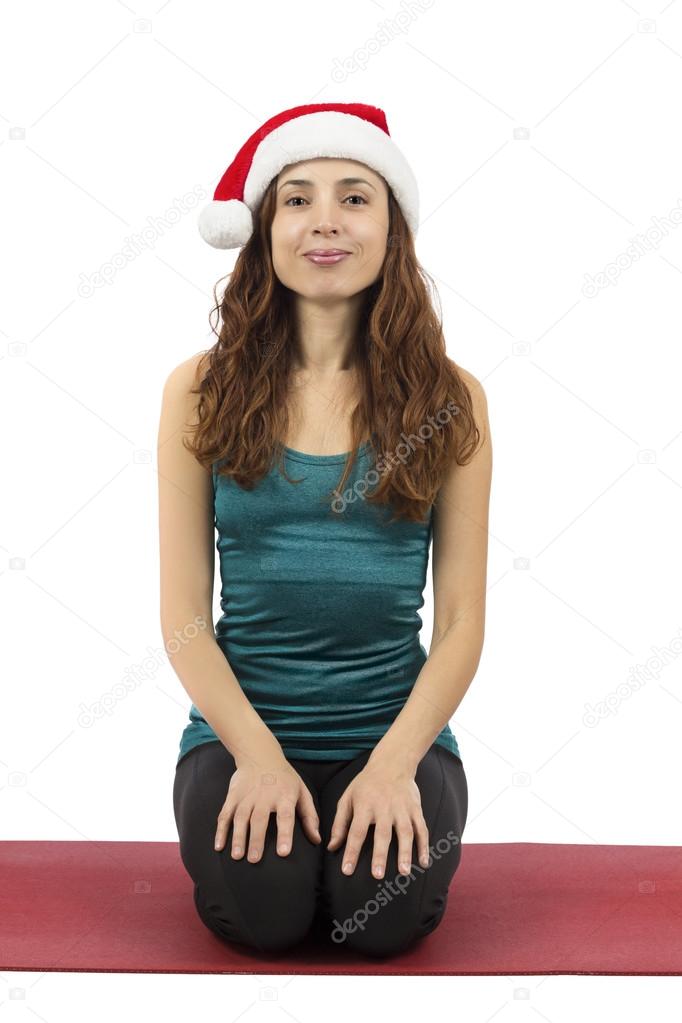 Christmas woman doing hero pose in yoga