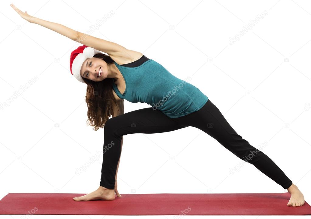 Christmas yoga woman doing extended side angle pose