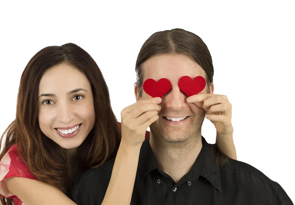 Couple smiling and holding hearts — Stock Photo, Image