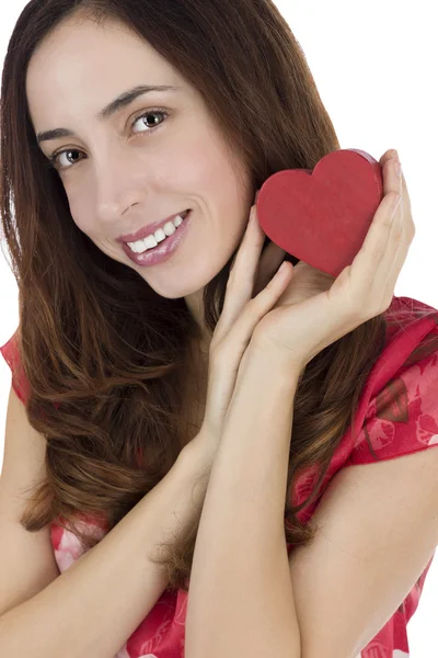 Smiling woman holding a heart Stock Image