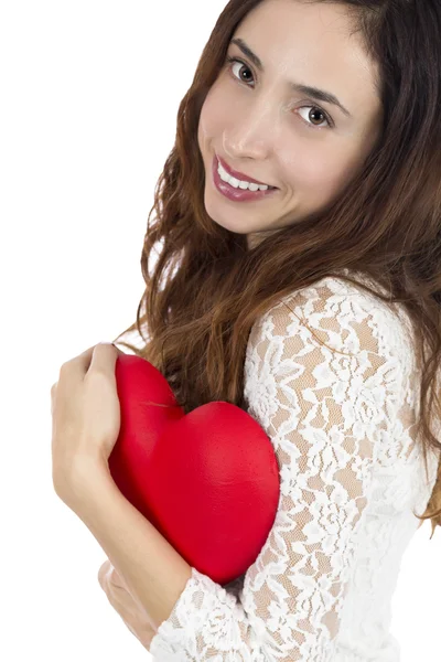 Valentín mujer sosteniendo un corazón rojo en sus brazos — Foto de Stock