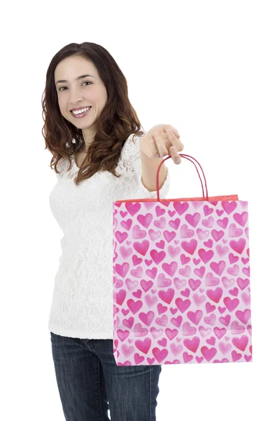 Femme heureuse montrant sac cadeau — Photo