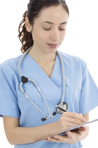 Nurse keeping notes on clipboard — Stock Photo, Image