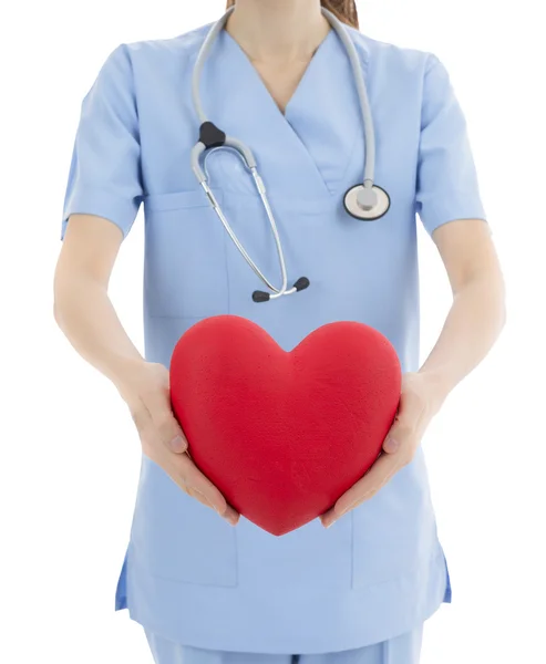 Lekarz posiadający serce w jej ręce — Zdjęcie stockowe