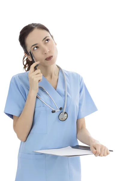 Female doctor or nurse thinking about a solution — Stock Photo, Image