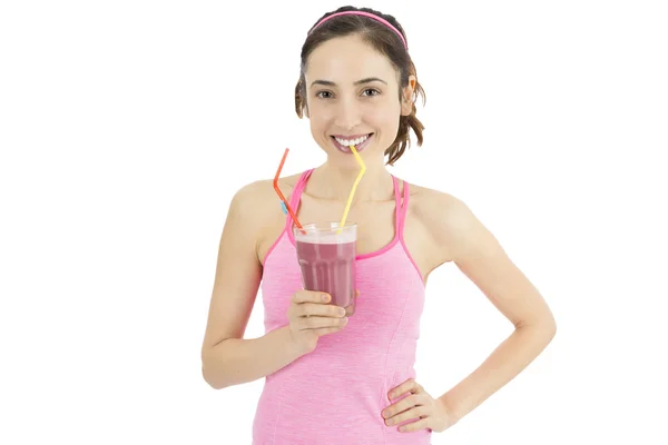 Aantrekkelijke sportieve vrouw drinken smoothie — Stockfoto