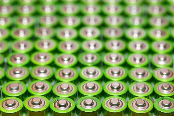 stock image Used alkaline batteries AA size format of different brands lying in a rows. top view background texture of electric batteries and accumulators AA. AA packed close to each other. Used AA batteries