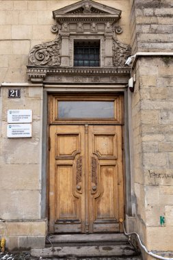 25.02. 2021 City of Lviv, Ukraine, Rynok Square. Original authentic doors on the outskirts of Rynok Square in Lviv. Authentic architecture of the city of Lviv. Doors of the city of Lviv. 