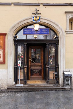25.02. 2021 City of Lviv, Ukraine, Rynok Square. Original authentic doors on the outskirts of Rynok Square in Lviv. Authentic architecture of the city of Lviv. Doors of the city of Lviv.