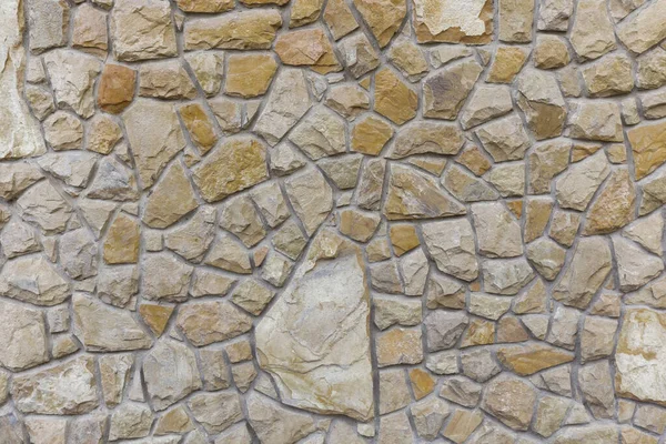 Gray stone wall background. Stone wall texture. Old castle stone wall texture background. Stone wall as background or texture. Part of a stone wall, for background or texture.