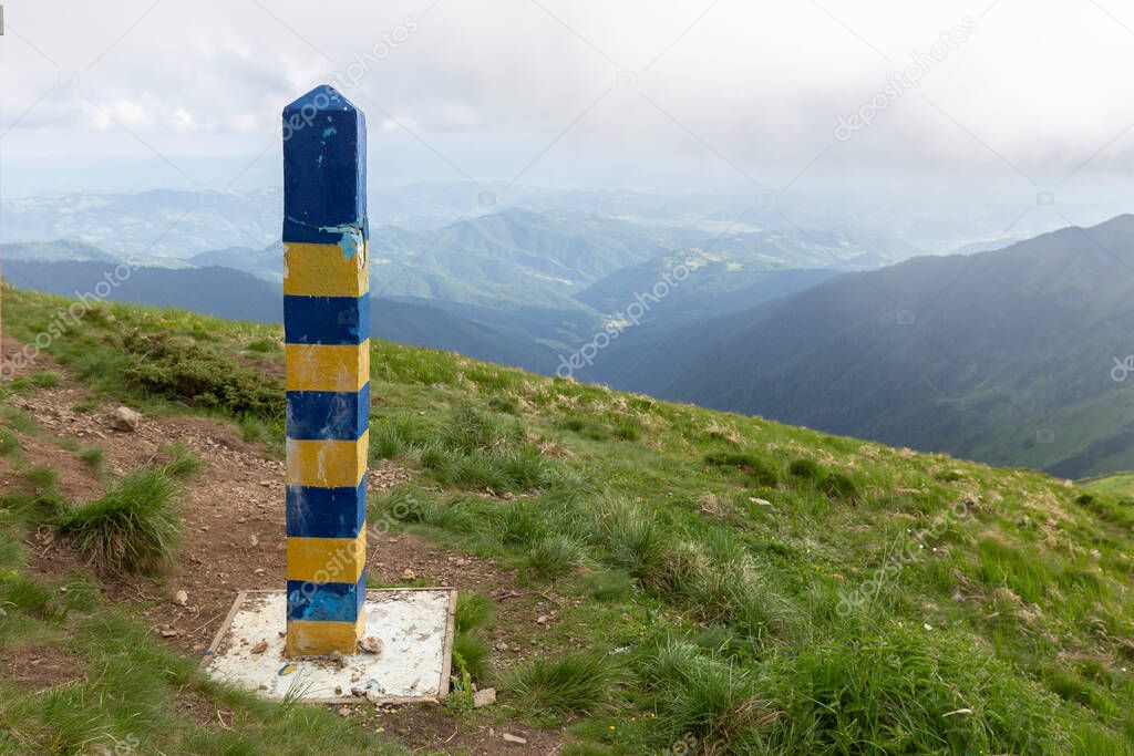 Border demarcation pillar on the border between Ukraine and Romania in the Carpathian Mountains.