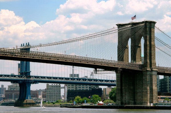 NYC: The gothic east tower of the Brooklyn Bridge and the adjacent Manhattan Bridge over the East River