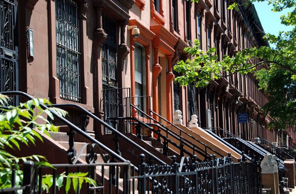 NYC: Handsome brownstone homes, many restored, line West 131st Street just Frederick Douglass Boulevard in Harlem