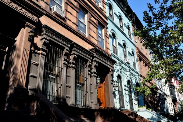 NYC: Classic late 19th century brownstones with stoops and stairs line West 78th Street on the Upper West Side