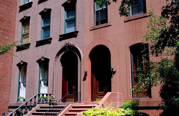 BROOKLYN HEIGHTS, NY: Classic late 19th Century brownstone homes with stoops and arched doorways on Joralemon Street