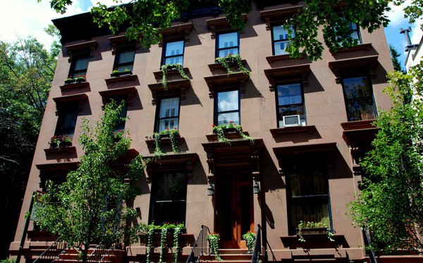 BROOKLYN HEIGHTS, NY: An elegant 19th century mansion with flowering window boxes in the Brooklyn Heights historic district