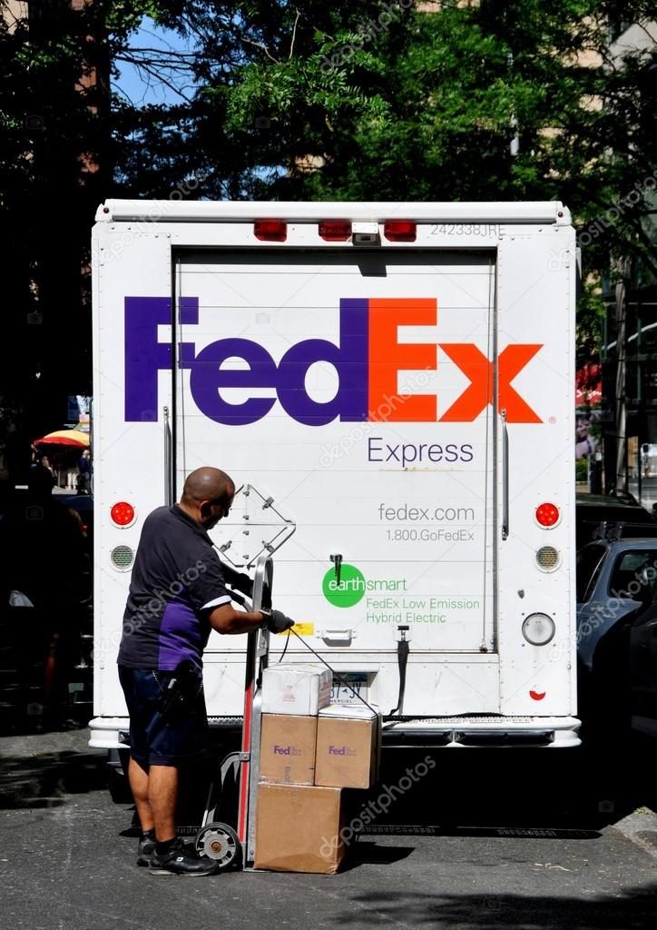 NYC:  A FEDEX delivery man readies packages behind his truck as he prepares to make a delivery to an Upper West Side residential address