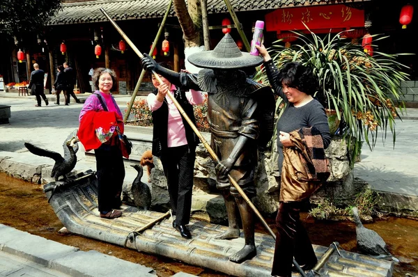 Jie Zi Ancient Town, China:Women with Public Art Sculpture — Stock Photo, Image