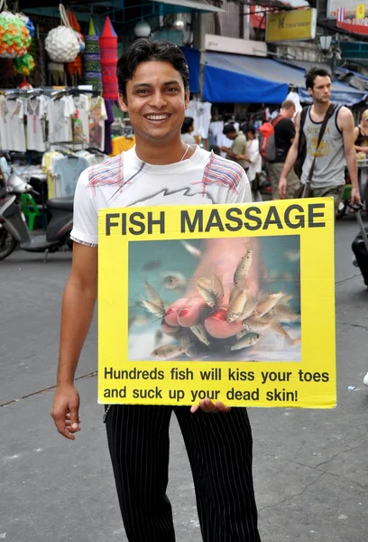 Bangkok, Thailand: Man Holding Fish Massage Sign — Stock Photo, Image