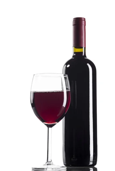 Botella y copa de vino tinto — Foto de Stock