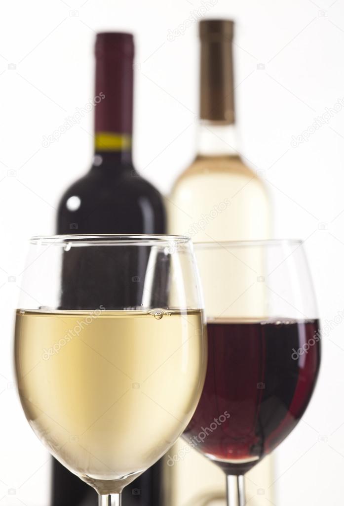 Red and white wine bottles with glasses