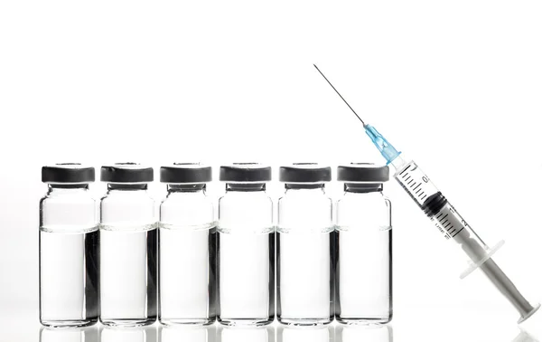 Glass Medicine Vials and Syringe on white background — Stock Photo, Image