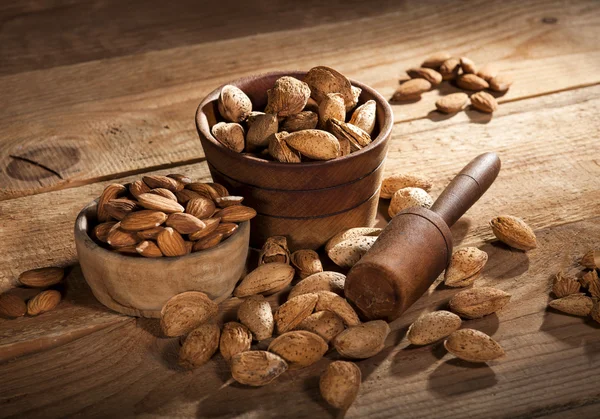 Almond nuts on wooden background — Stock Photo, Image