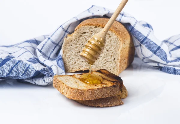 Bröd och honung Stockbild