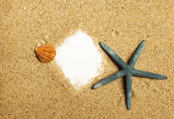 Starfish and sheet of paper with sand — 图库照片