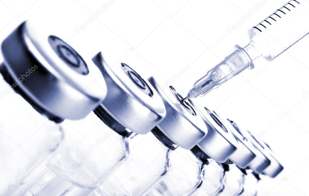 Vials and Syringe — Stock Photo © NikiLitov 76868721